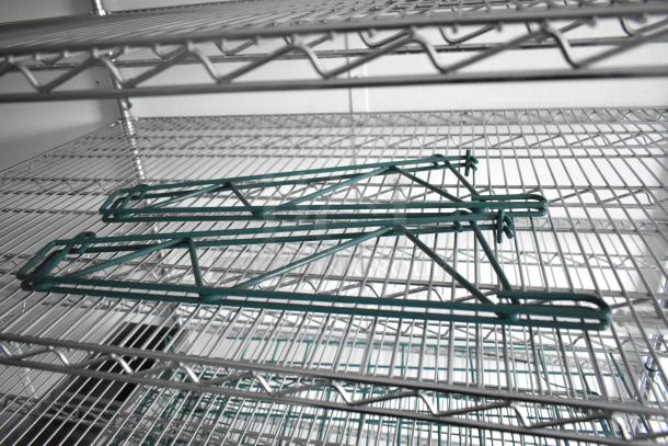 Wire shelving units inside a 2020 SDG 8.5' x 20' food trailer shell, ready to be equipped, in excellent condition.