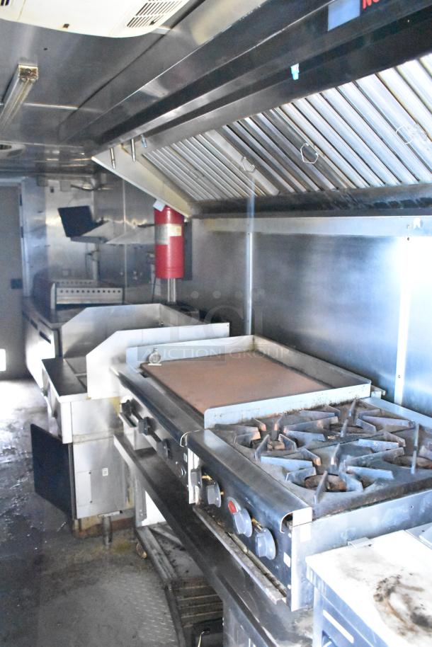 2019 Cruising Kitchens 8.5' x 24' trailer with CaptiveAire grease hood, Arctic Air prep tables, and fire suppression system.