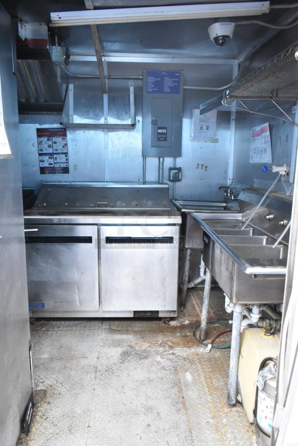 2019 Cruising Kitchens cold food trailer with CaptiveAire grease hood, Arctic Air prep tables, and Martin IT cabinet.