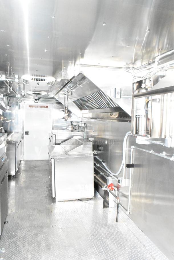 2020 ATX Covered Wagon Trailers mobile kitchen with TurboChef oven, CaptiveAire hood, Arctic Air fridge, and full plumbing.