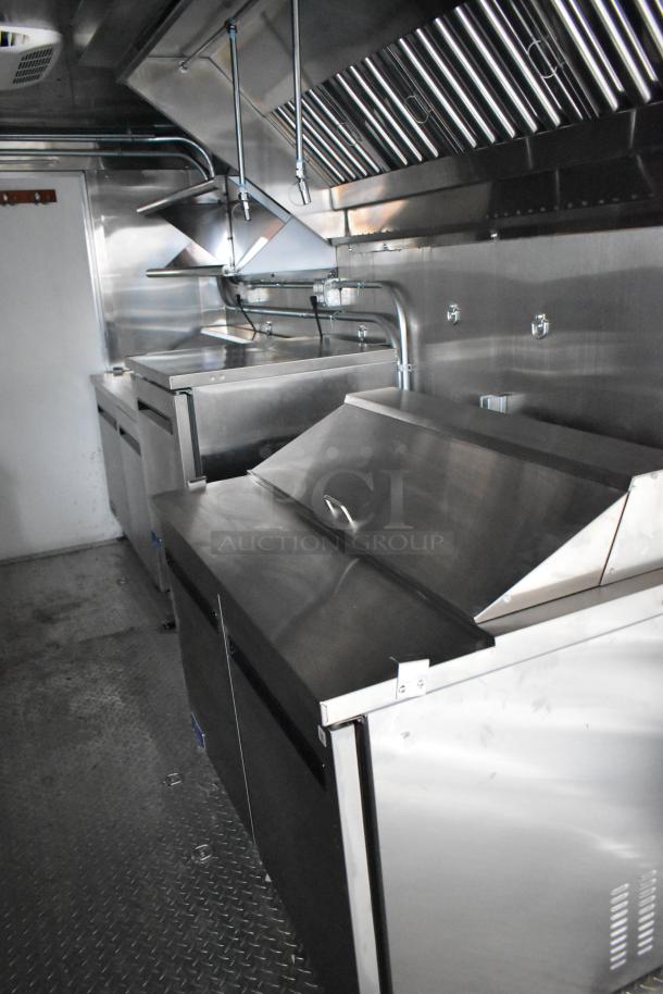 2020 ATX Covered Wagon 8.5' x 24' mobile kitchen trailer interior; features stainless appliances, grease hood, TurboChef oven.