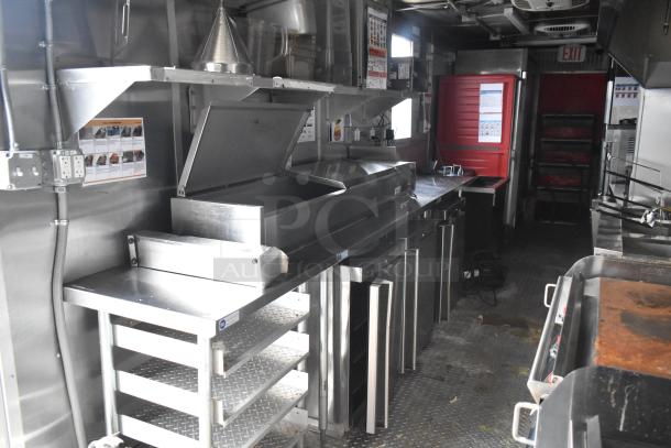 2021 Titanium Cargo 8.5' x 28' mobile kitchen trailer with Henny Penny fryer, Taylor soft serve, Garland griddle, and CaptiveAire hood.