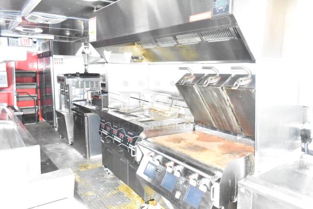 2021 Titanium Cargo 8.5' x 28' mobile kitchen with Henny Penny fryer, Taylor soft serve, Garland griddle, CaptiveAire hood.