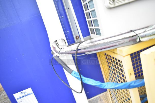Mobile kitchen trailer exterior with visible wiring and vents, part of fully outfitted Burger King setup.