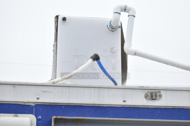 Mobile kitchen trailer with plumbing and ventilation pipes visible, part of a Burger King spec setup, VIN 7H2BE2836MD037335.