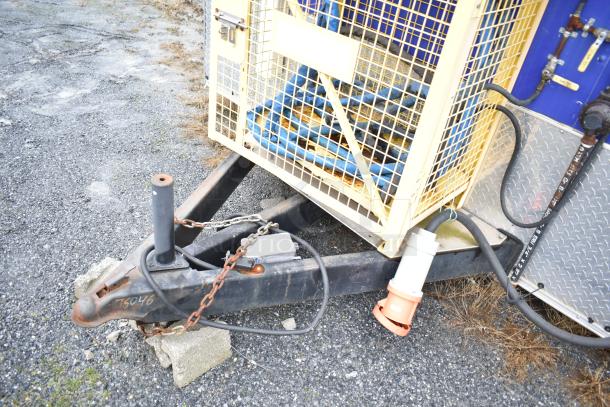 Burger King mobile kitchen trailer hitch with chains and cables; visible grill, cooler suite; triple axle, rugged condition.