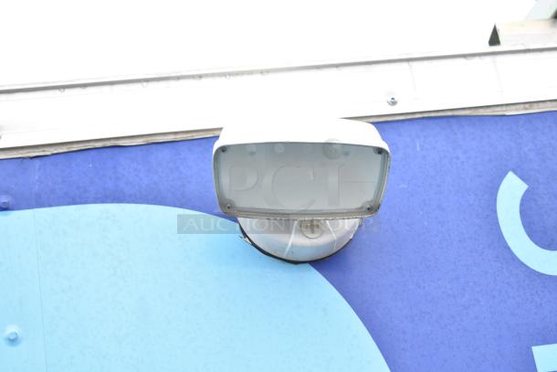 Exterior detail of the mobile kitchen trailer showing a white vent on a blue background.