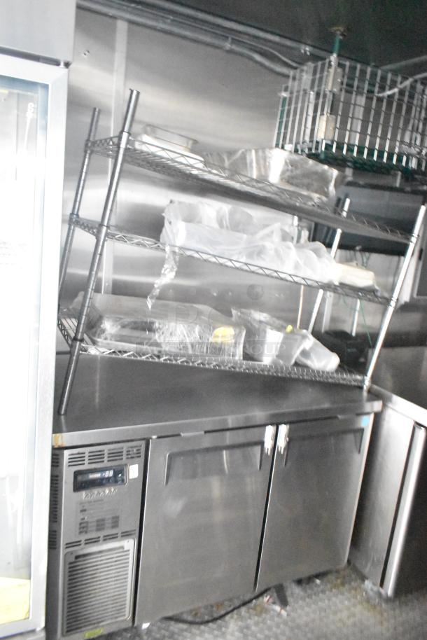 Fully equipped mobile kitchen trailer with CaptiveAire hood, Pitco fryers, Arctic Air coolers, and full POS system.