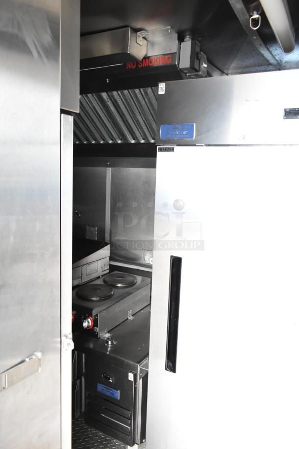 Fully outfitted mobile kitchen trailer with CaptiveAire hood, Pitco fryers, Arctic Air freezer, and air conditioning system.