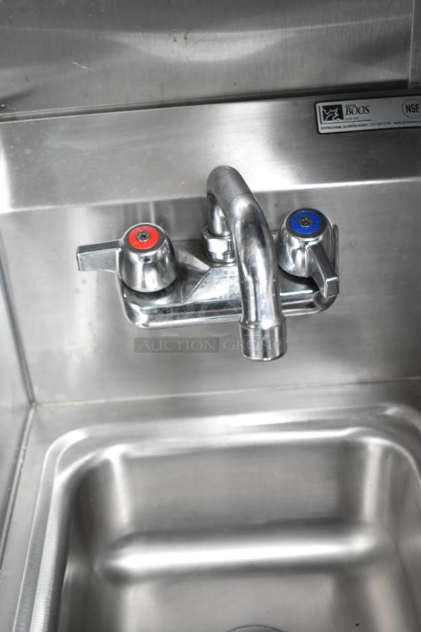 Stainless steel sink with dual temperature faucet, NSF-certified by John Boos, part of mobile kitchen trailer.