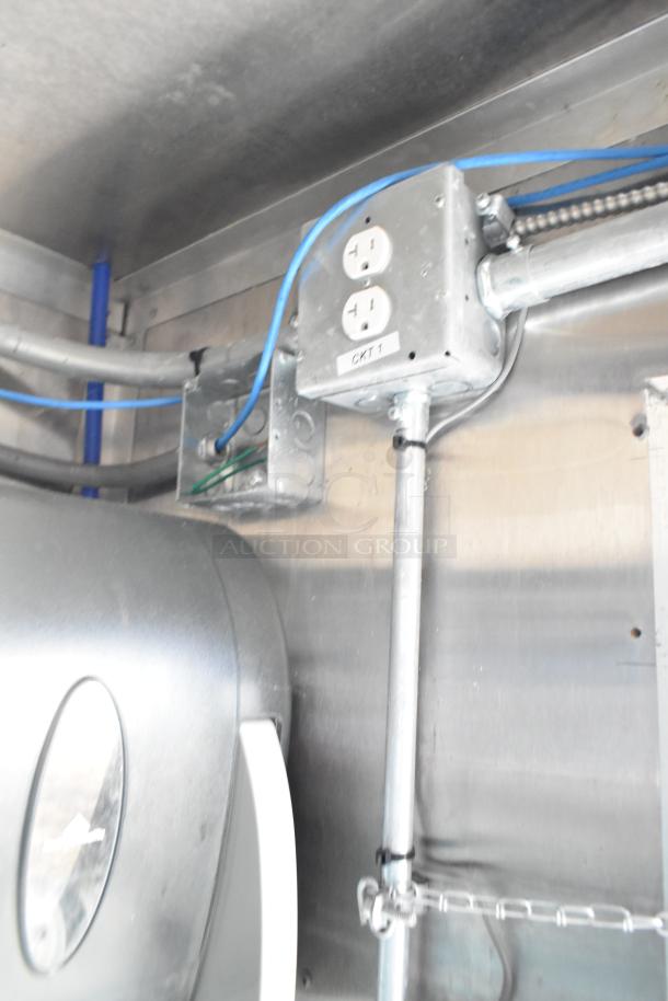 Mobile kitchen trailer interior showing electrical outlet labeled "CKT 1" and wiring setup.