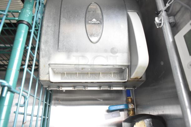 CaptiveAire hood system in mobile kitchen trailer, showing piping and control panel, part of a fully outfitted setup.