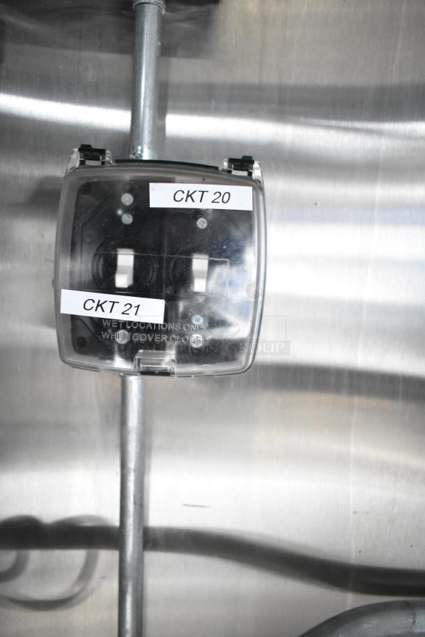 Electrical switch with clear cover labeled "CKT 20" and "CKT 21" for wet locations, indicating circuit assignments.