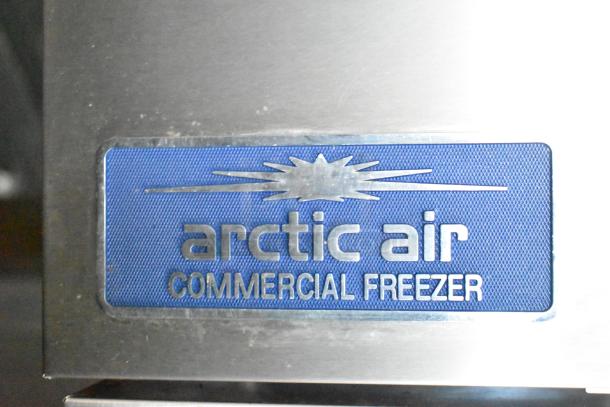 Arctic Air Commercial Freezer label, featuring a blue background and metallic lettering. Key component of a mobile kitchen trailer.