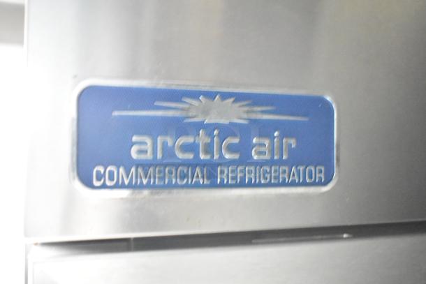 Arctic Air commercial refrigerator label on mobile kitchen trailer, indicating inclusion of refrigeration equipment.