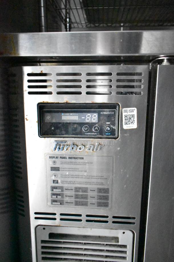 Turbo Air refrigeration unit with digital display in a mobile kitchen trailer. Features temperature settings and operating instructions.