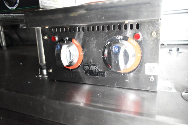 Star Max control panel with dual knobs for temperature adjustment, featuring settings from low to high. Marks visible.