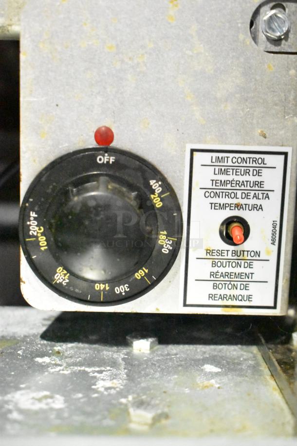 Temperature control dial with settings up to 400°F and reset button, part of mobile kitchen infrastructure.