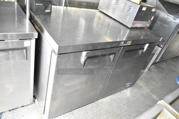 Fully outfitted mobile kitchen trailer with CaptiveAire hood, Arctic Air prep tables, Pitco fryers, and POS system.