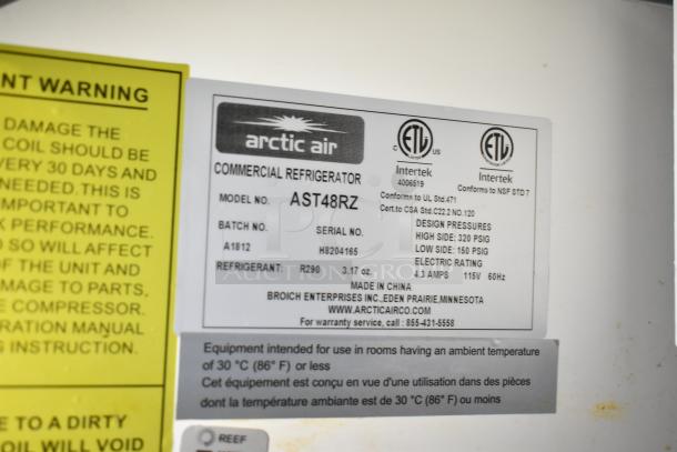 Label on Arctic Air commercial refrigerator, model AST48RZ, showing specifications, refrigerant type R290, and design pressures.