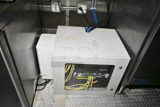 Mobile kitchen trailer with CaptiveAire hood, Pitco fryers, Arctic Air units, A/C, full POS system, visible wiring, and outlets.