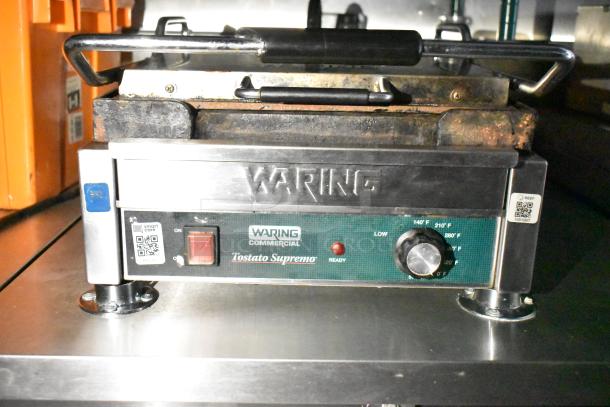 Waring Commercial Tostato Supremo grill in used condition, features temperature control dial, on/off switch, and QR code labels.