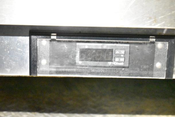 Digital control panel on fully outfitted mobile kitchen trailer by CaptiveAire, showing temperature settings and Dixell branding.