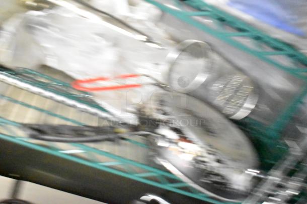 Blurry image of kitchen equipment; details on CaptiveAire hood, Pitco fryers, Arctic Air units, and POS system unavailable.