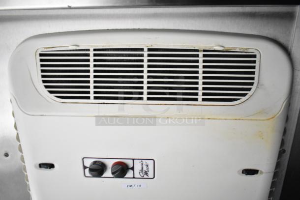 Air conditioning unit inside a mobile kitchen trailer with controls labeled "Climate Master" and a tag "CKT 14."