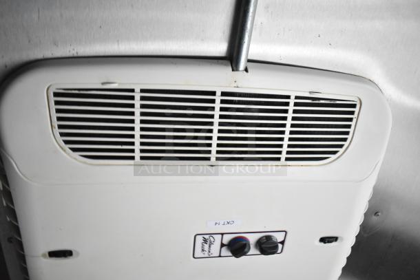 Air conditioning vent in a mobile kitchen trailer, featuring control dials below labeled "ARC 14".