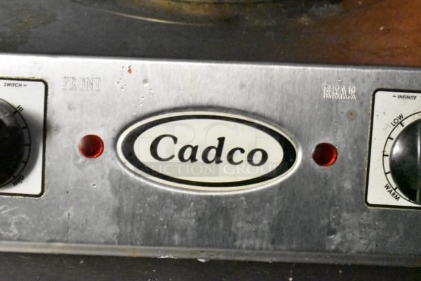 Cadco control panel, features dials with settings from low to high; front and rear indicators present on a metallic surface.