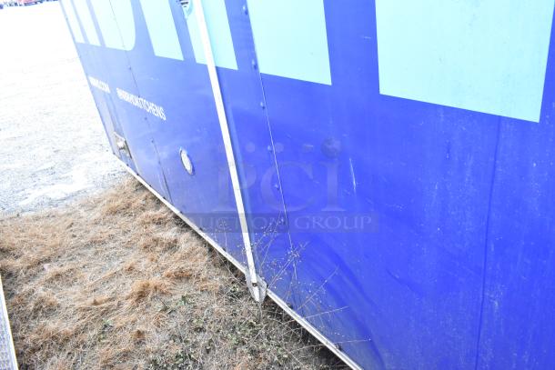 Mobile kitchen trailer with CaptiveAire hood, Pitco fryers, and Arctic Air prep stations. Exterior shows light wear.