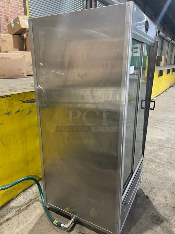 Old Hickory N14G stainless steel rotisserie oven, 2022 model, natural gas, 14-spit, sliding glass doors, on casters.