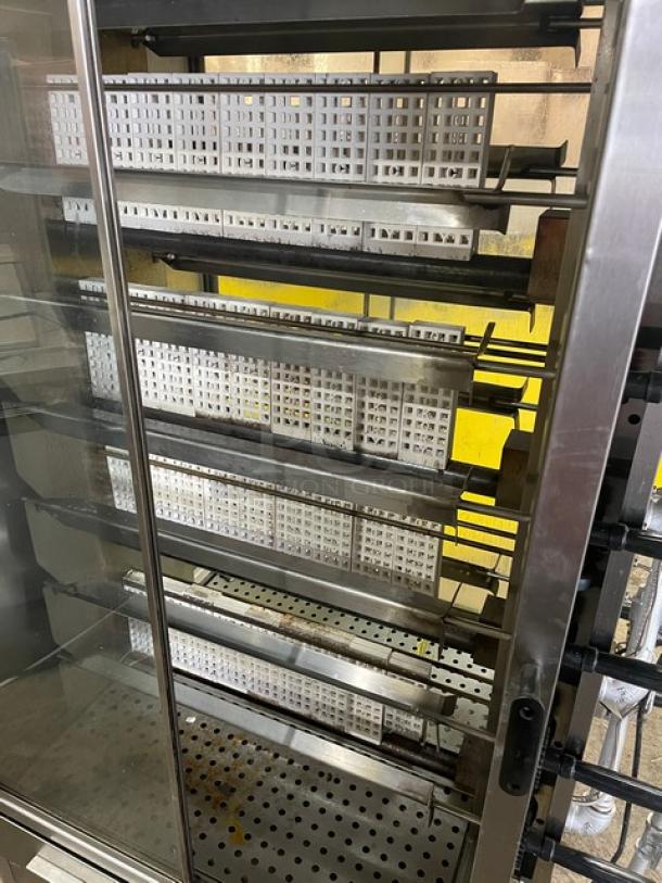 Old Hickory 2022 N14G rotisserie oven, 14 spits, stainless steel, natural gas, double-sided with sliding glass doors, on casters.