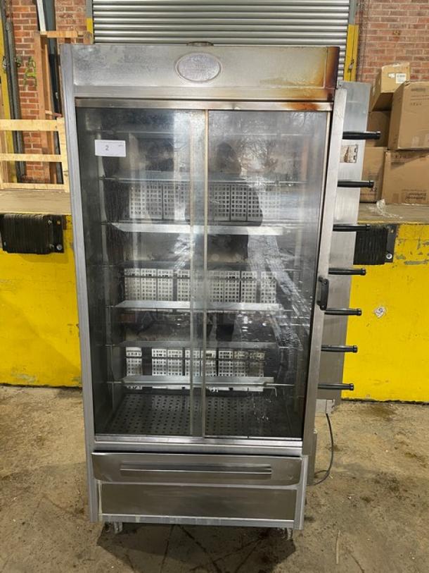 Old Hickory 2021 commercial stainless steel rotisserie oven, model N7GRH, with 7 spits, sliding glass door, 120V, on casters.