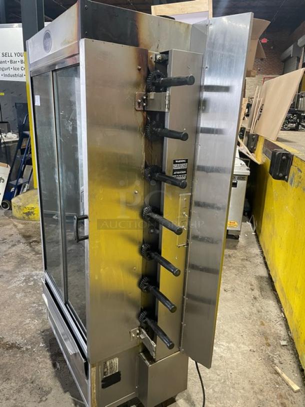 Old Hickory N7GRH commercial stainless steel 7-spit rotisserie oven, natural gas, sliding glass door, on casters.