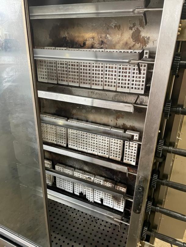 Old Hickory N7GRH stainless steel rotisserie oven with 7 spits, front sliding glass door, and casters, Model: N/7GRH.