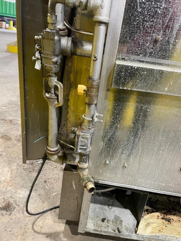 Old Hickory 2021 stainless steel 7-spit rotisserie oven, model N7GRH, natural gas, sliding glass door, on casters, 120V 1 phase.