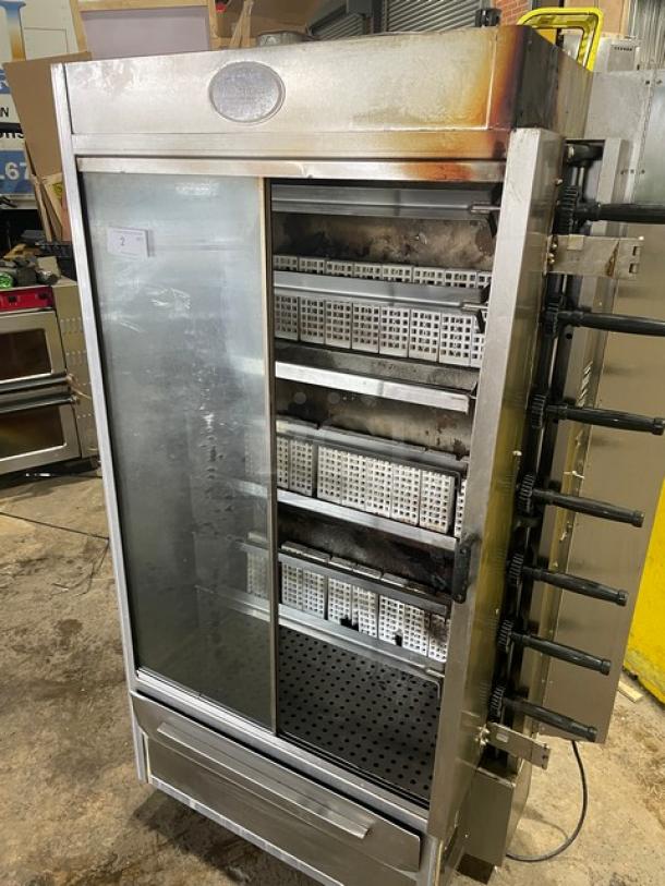 Old Hickory N7GRH stainless steel 7-spit rotisserie oven, natural gas, with sliding glass door, on casters, 2021 model.