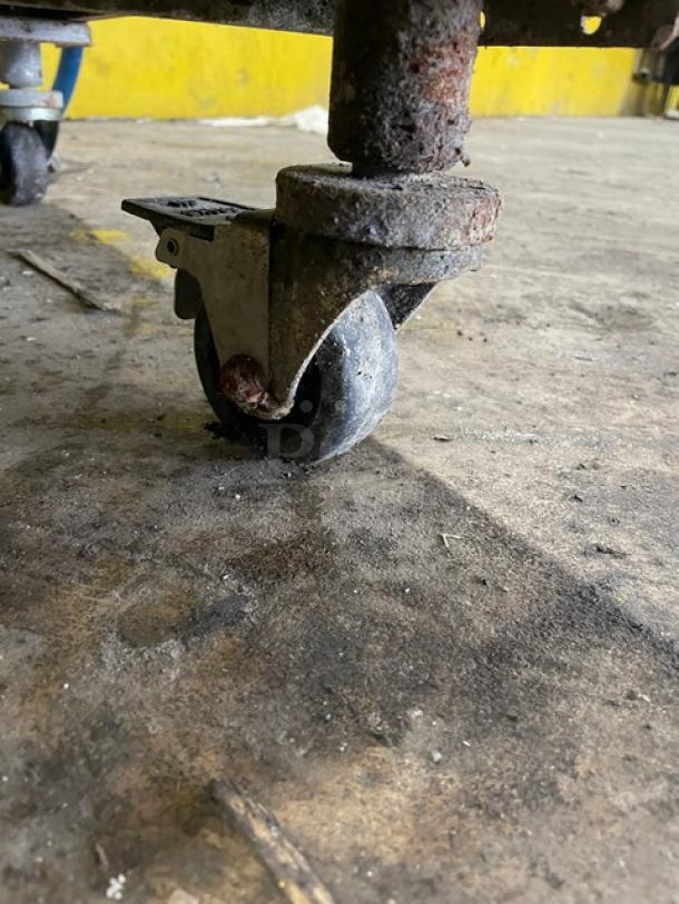 Rusty caster wheel on the Pitco SRTG commercial rethermalizer/pasta cooker, highlighting wear and mobility feature.
