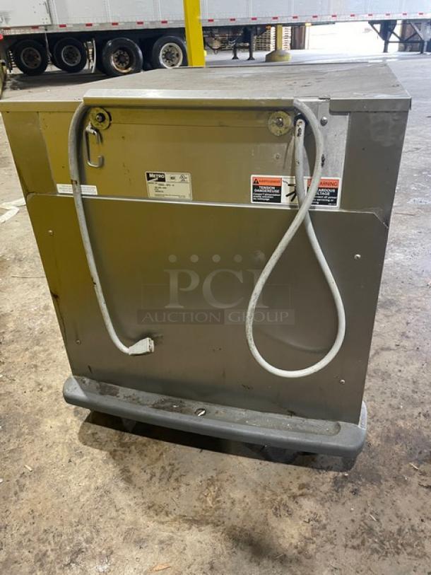 Metro C5 Series stainless steel electric undercounter heated cabinet, model C593LSFSU, with universal pan rack, corner bumpers, and casters.