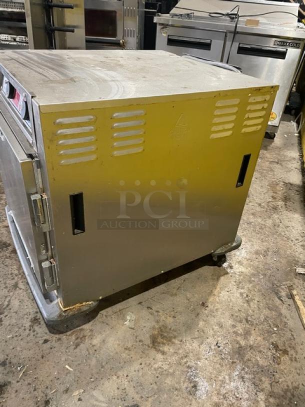 Metro C593L-SFS-U stainless steel undercounter heated cabinet with universal pan rack and corner bumpers on casters, model C593LSFSU.