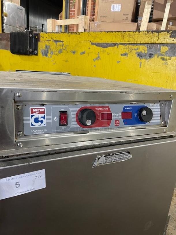 Metro C5 Series stainless steel undercounter heated cabinet, Model C593LSFSU, features universal pan rack, corner bumpers, 120V, on casters.