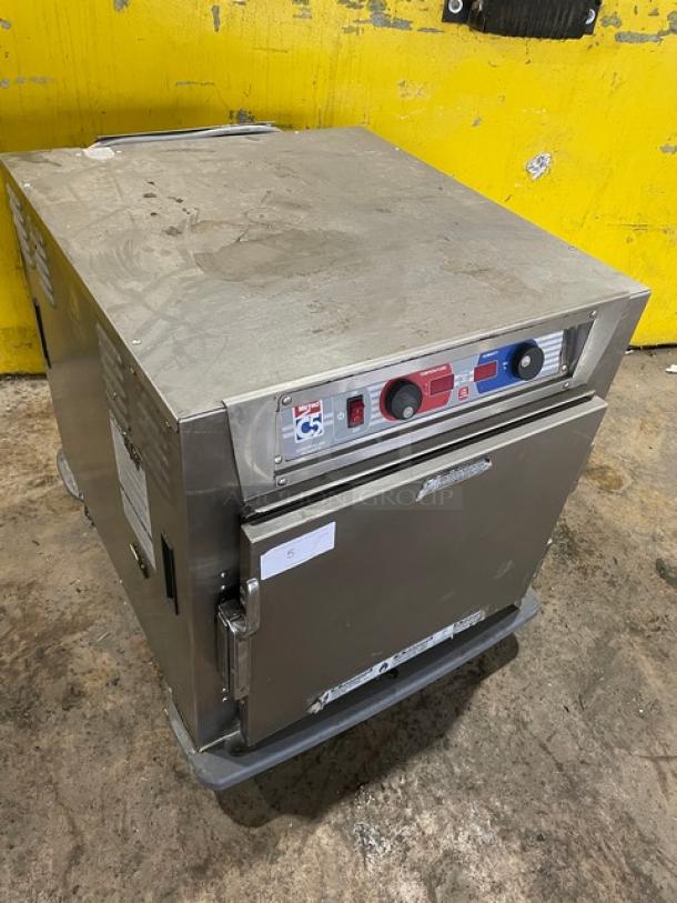 Metro C5 Series undercounter heated cabinet, model C593L-SFS-U, stainless steel, electric, with universal pan rack, corner bumpers, on casters.