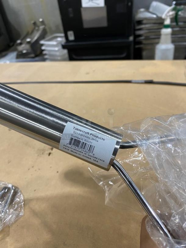 TableCraft 7418 stainless steel potato masher, 18" square face, new condition, visible product label.