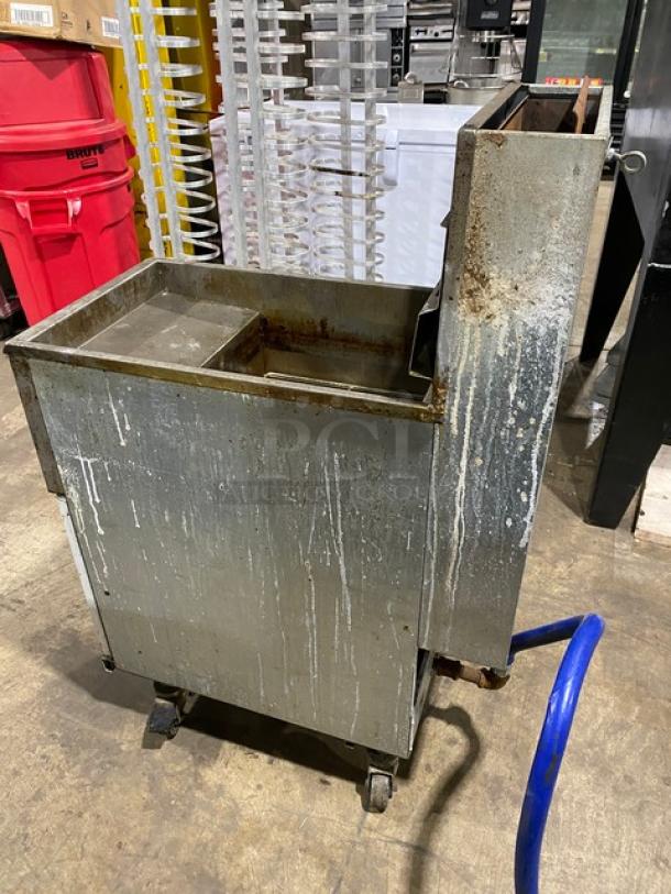 Pitco 45C-S stainless steel natural gas fryer, 42 lb capacity, with backsplash and basket hanger, on casters, fair condition.