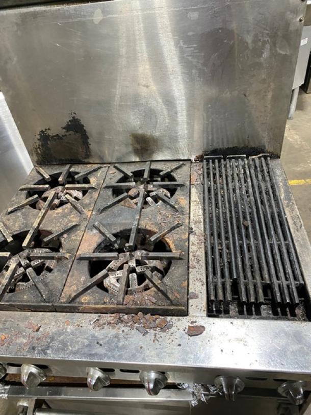 Jade Range stainless steel 4-burner gas char broiler range/oven combo, with backsplash and wired oven rack, on legs. Used condition.