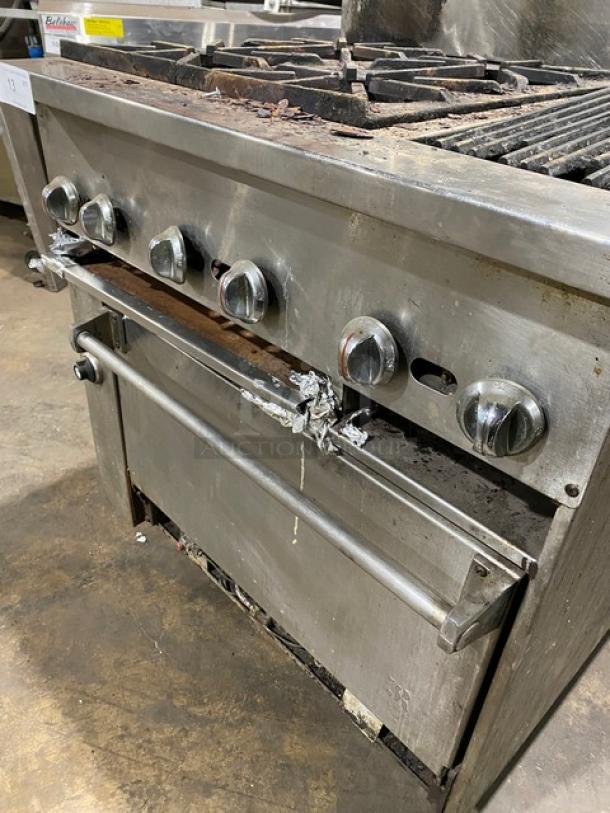 Jade Range commercial stainless steel gas-powered 4-burner char broiler range with oven, backsplash, and wired oven rack.