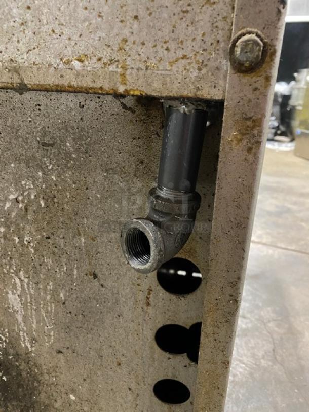 Jade Range commercial stainless steel gas-powered char broiler oven combo, features backsplash, wired oven rack, on legs.