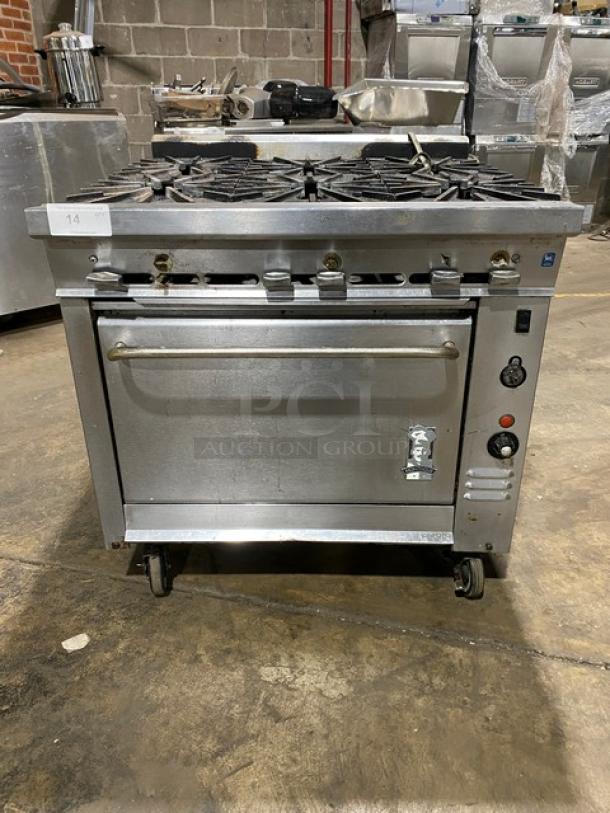 Montague commercial stainless steel gas 6-burner range with convection oven, on casters. Industrial-grade, excellent condition.